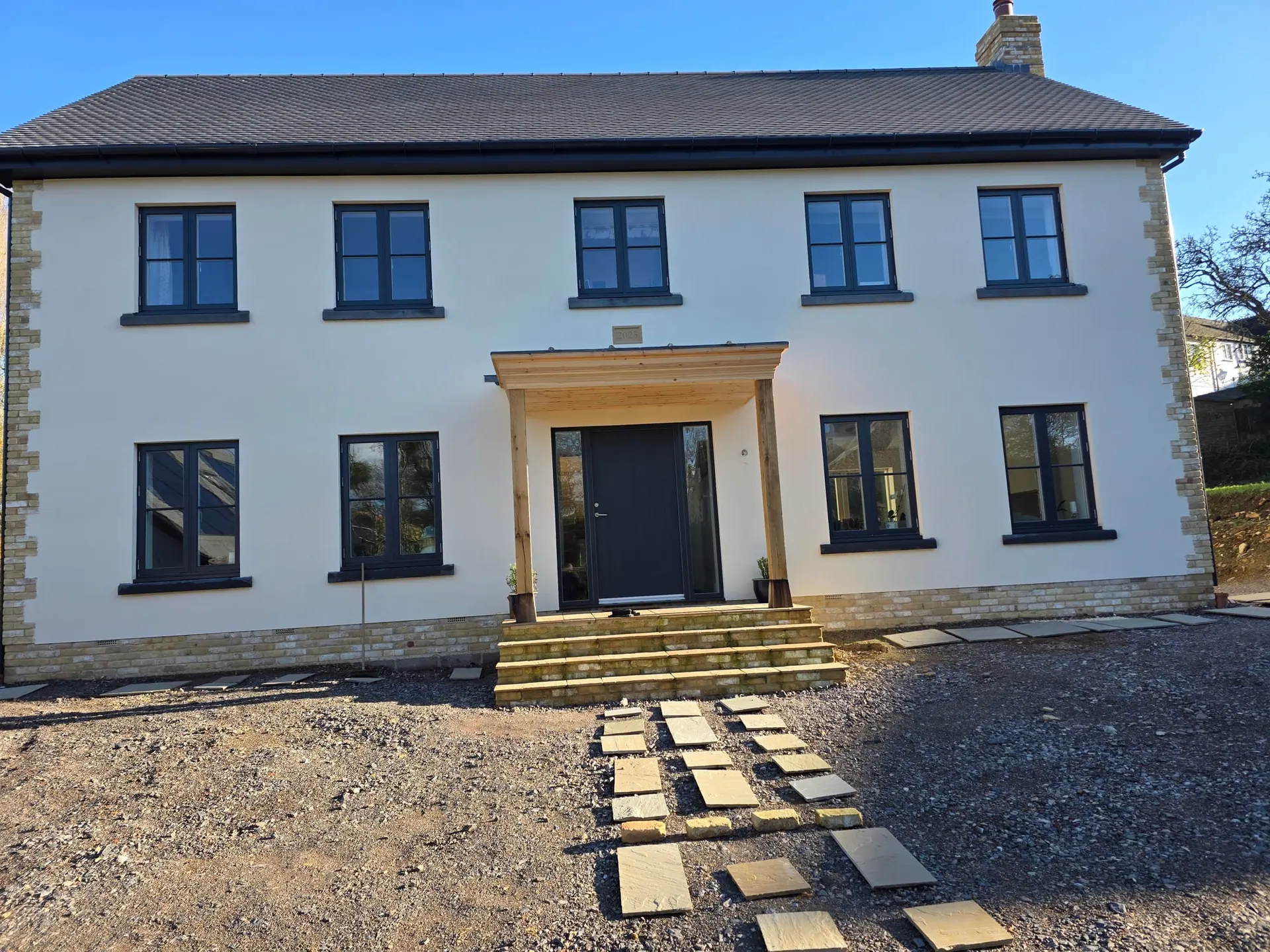 Finished two-storey new-build house with a stone porch